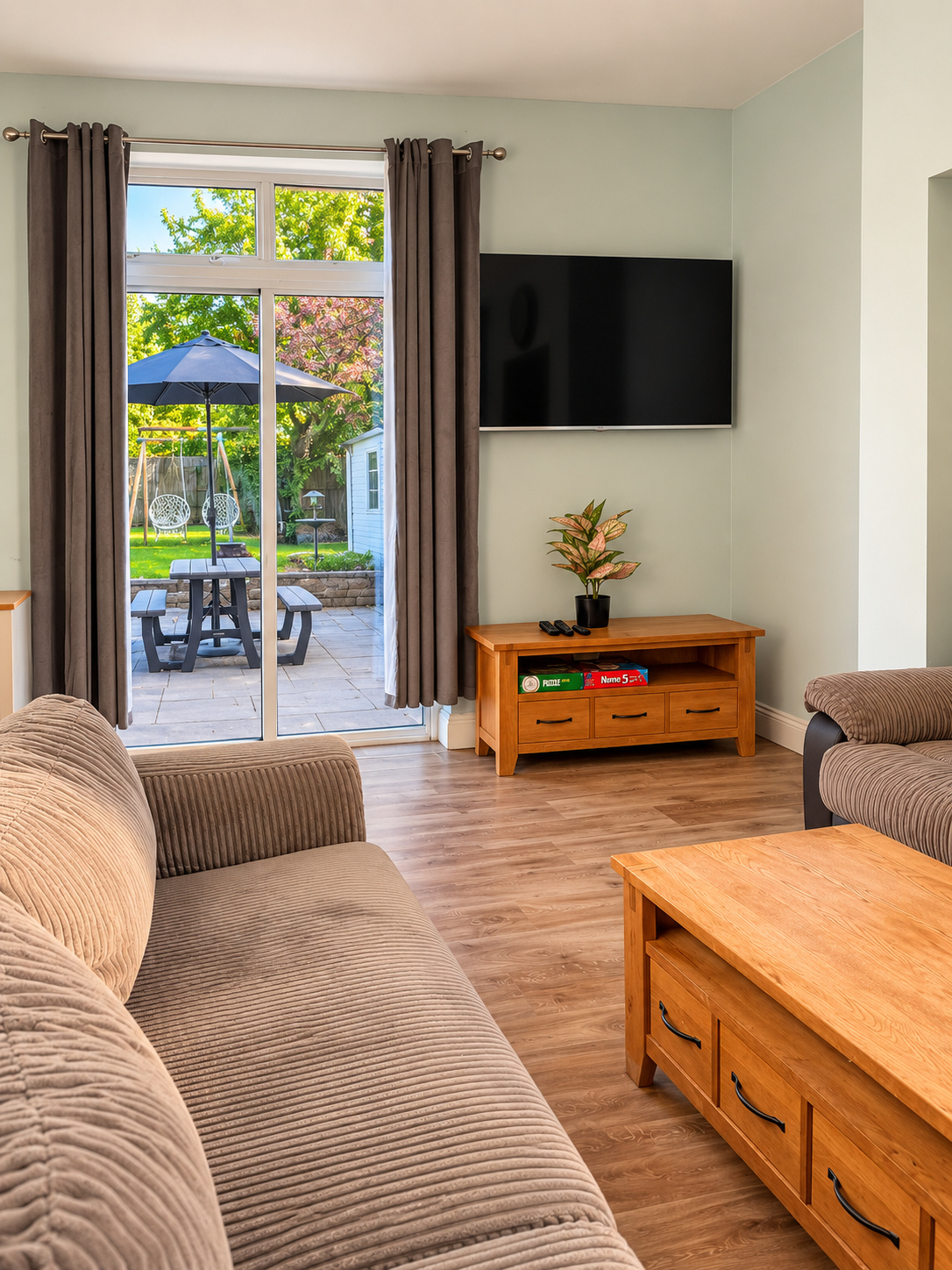 Lounge with sofas and garden doors at Ivie Lodge