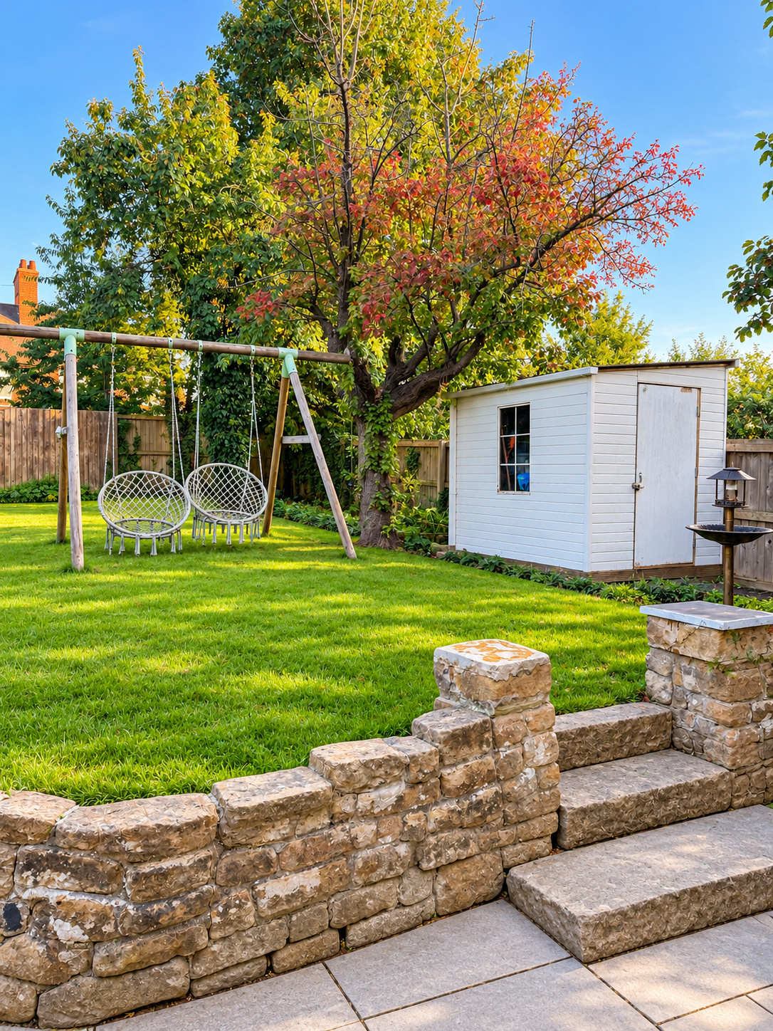 Garden with swings and summer house at Ivie Lodge